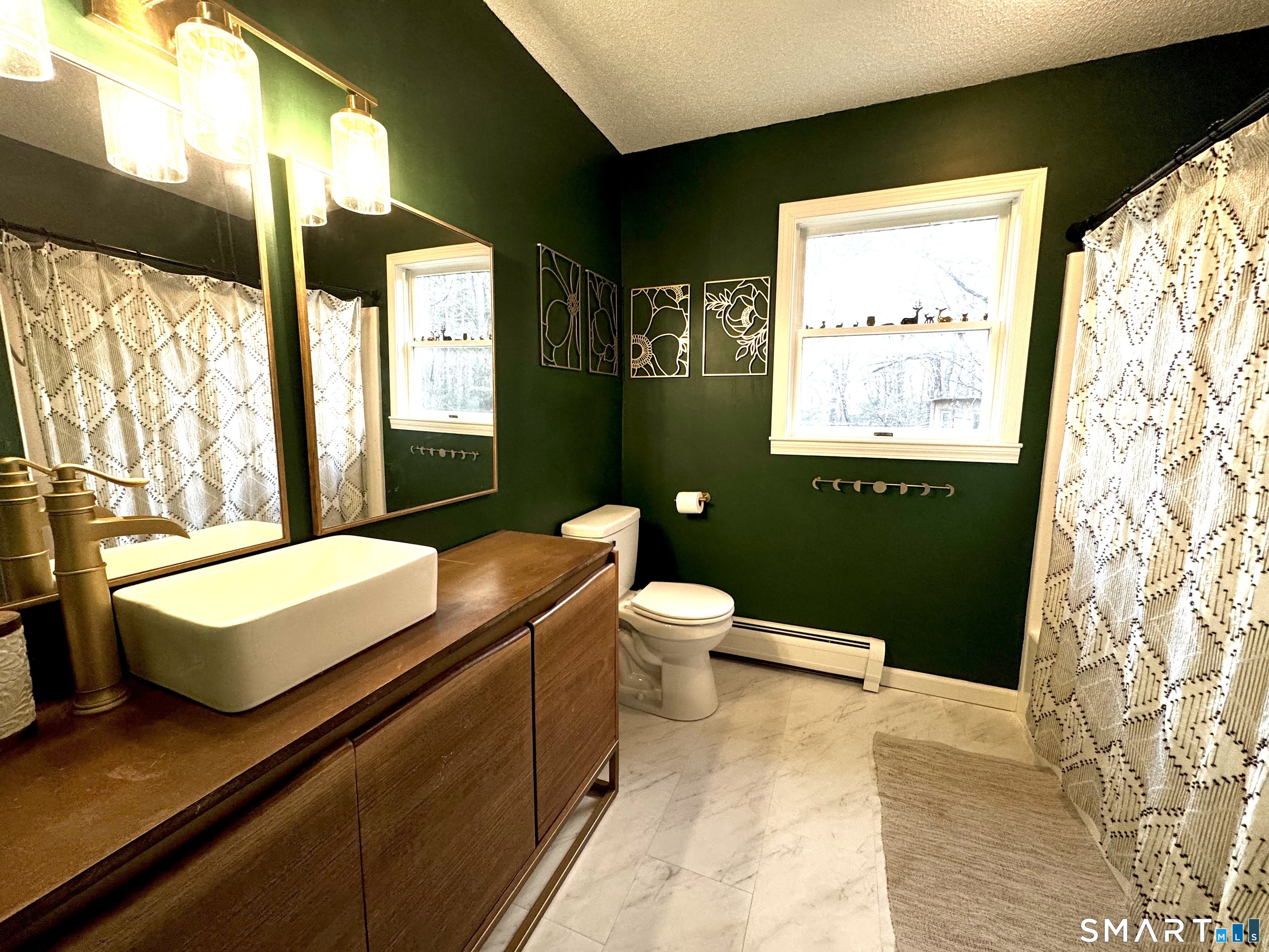 113 Michelec Road Stafford, CT 06076 - Photo 14 of 17 a bathroom with a toilet a sink and mirror