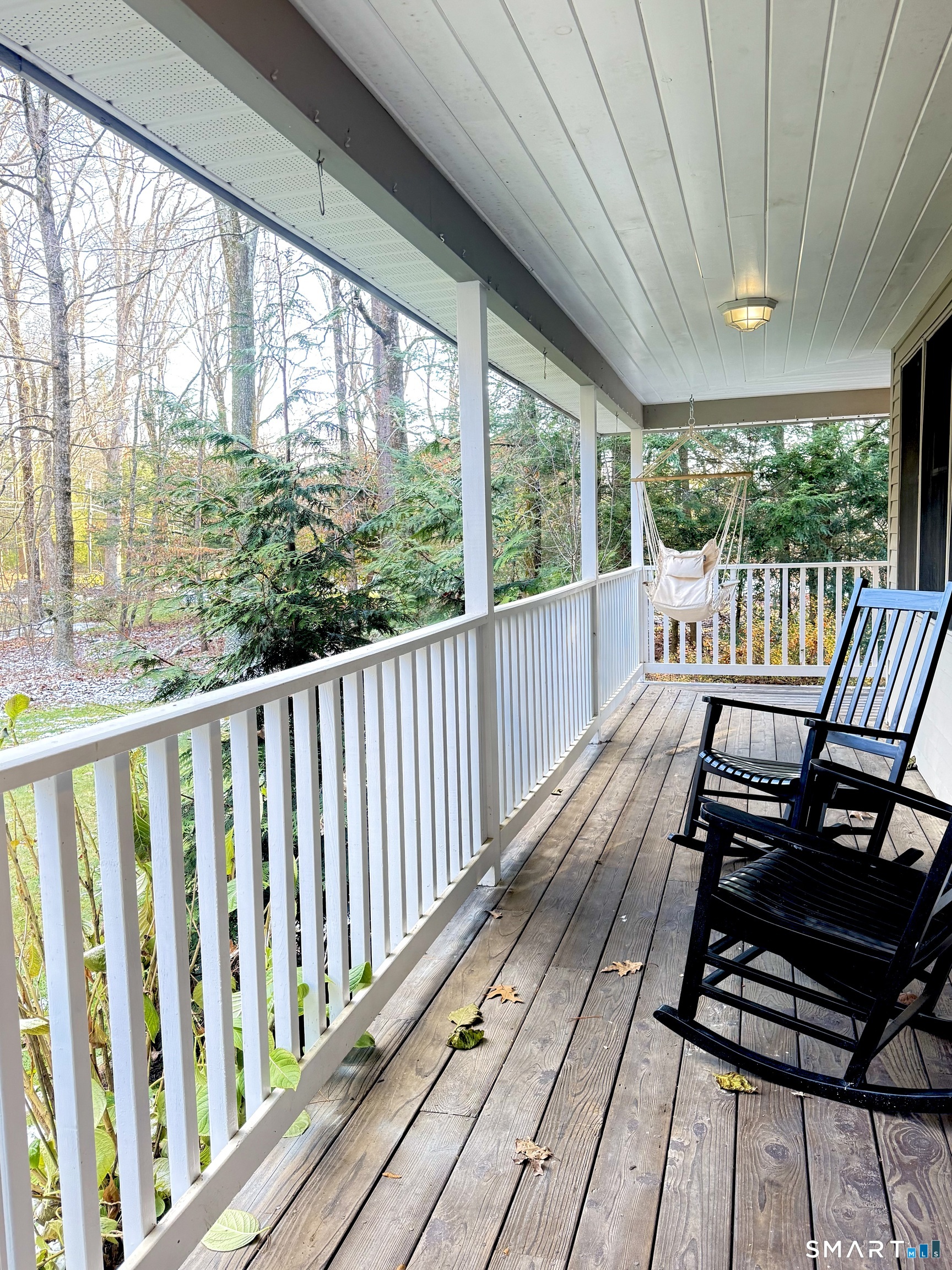 113 Michelec Road Stafford, CT 06076 - Photo 2 of 16 a view of a balcony with chairs and wooden floor