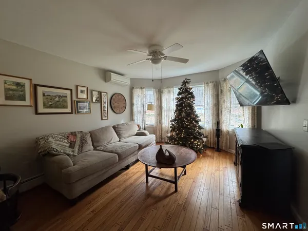 a living room with furniture and a window