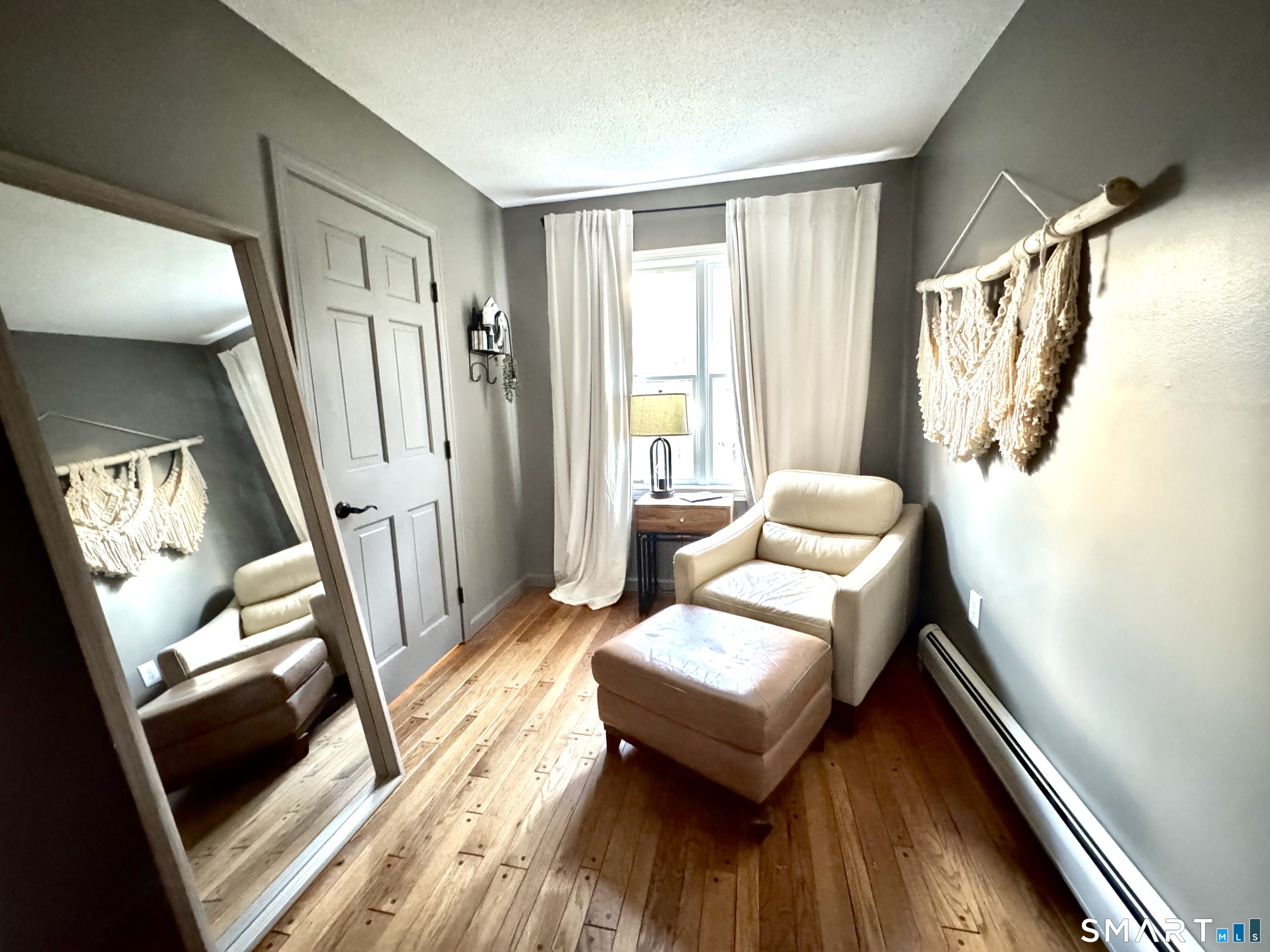 113 Michelec Road Stafford, CT 06076 - Photo 10 of 17 a living room with furniture and a wooden floor
