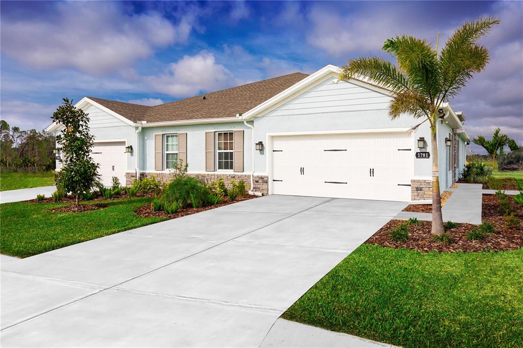1203 Turtle Is Road Lady Lake, FL 32159 - Photo 1 of 1 a front view of a house with a garden and yard