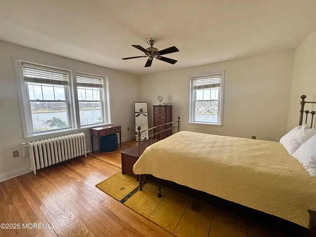 a bed room with a bed and a chandelier
