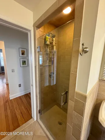 a bathroom with a tub and shower
