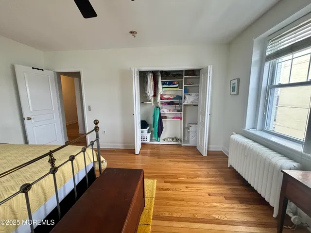 a bedroom with furniture and a window