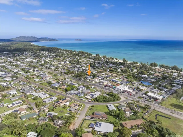 an aerial view of residential building and ocean