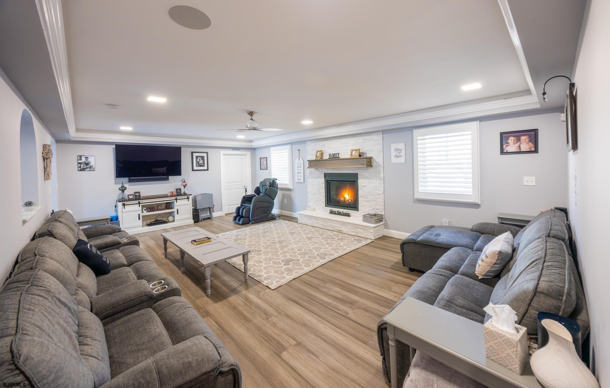 1309 Tyler Road Woodbine, NJ 08270 - Photo 18 of 84 a living room with furniture a flat screen tv and a fireplace