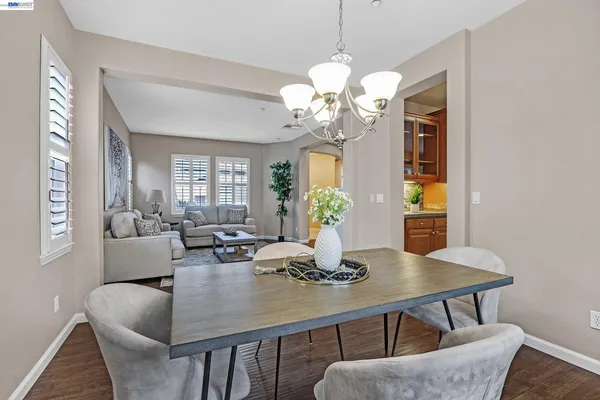 a kitchen with kitchen island granite countertop wooden cabinets and stainless steel appliances
