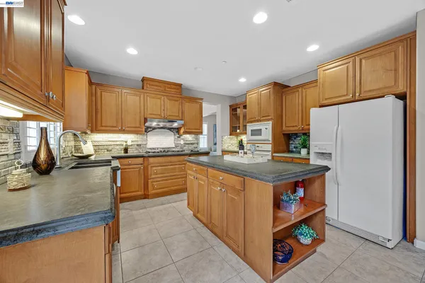a view of a dining room that has a table and chairs in it