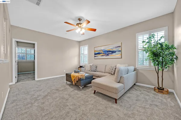 a spacious bathroom with a granite countertop tub sink and mirror