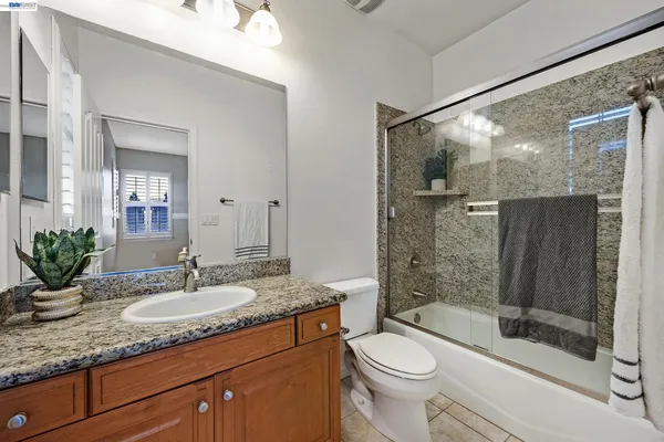 a view of a backyard with large trees