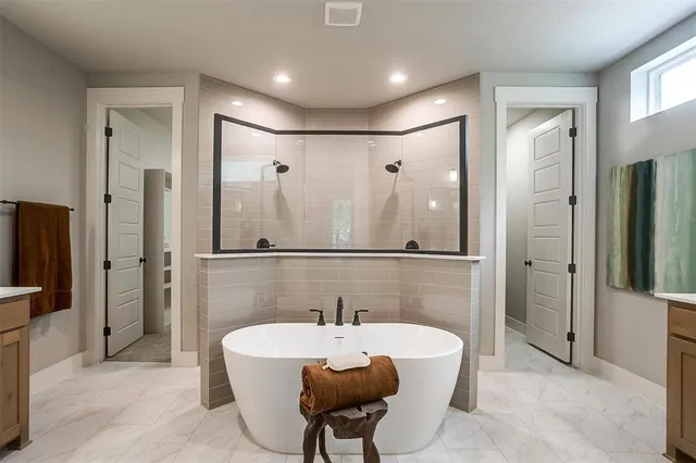 a bathroom with a bathtub and a sink