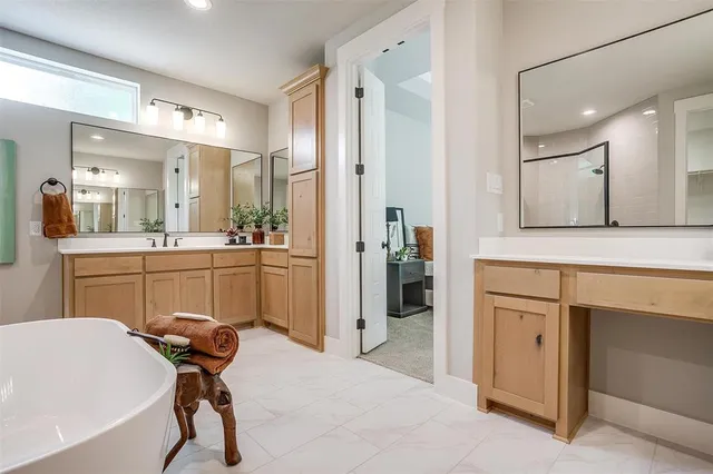 a kitchen with a refrigerator a sink and cabinets