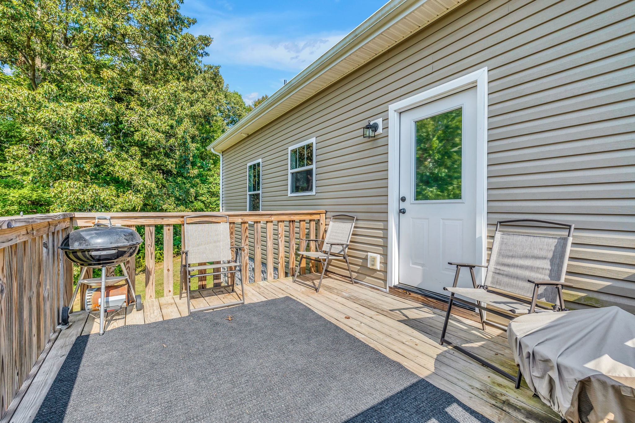 541 Murrell Road Dickson, TN 37055 - Photo 19 of 29 a balcony with wooden floor and outdoor seating