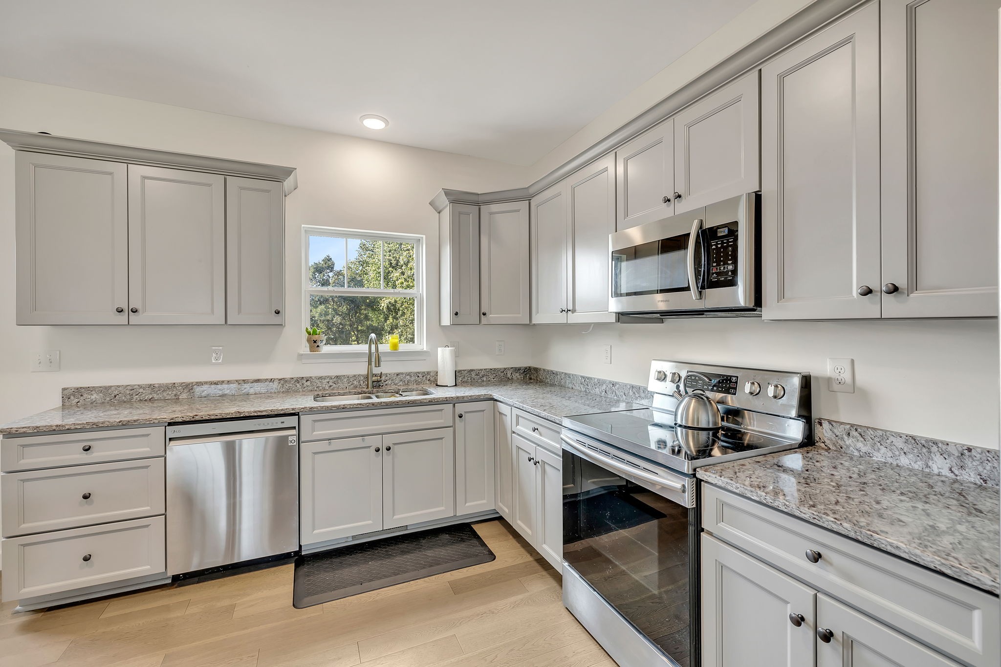 541 Murrell Road Dickson, TN 37055 - Photo 9 of 29 a kitchen with stainless steel appliances granite countertop white cabinets a sink and dishwasher
