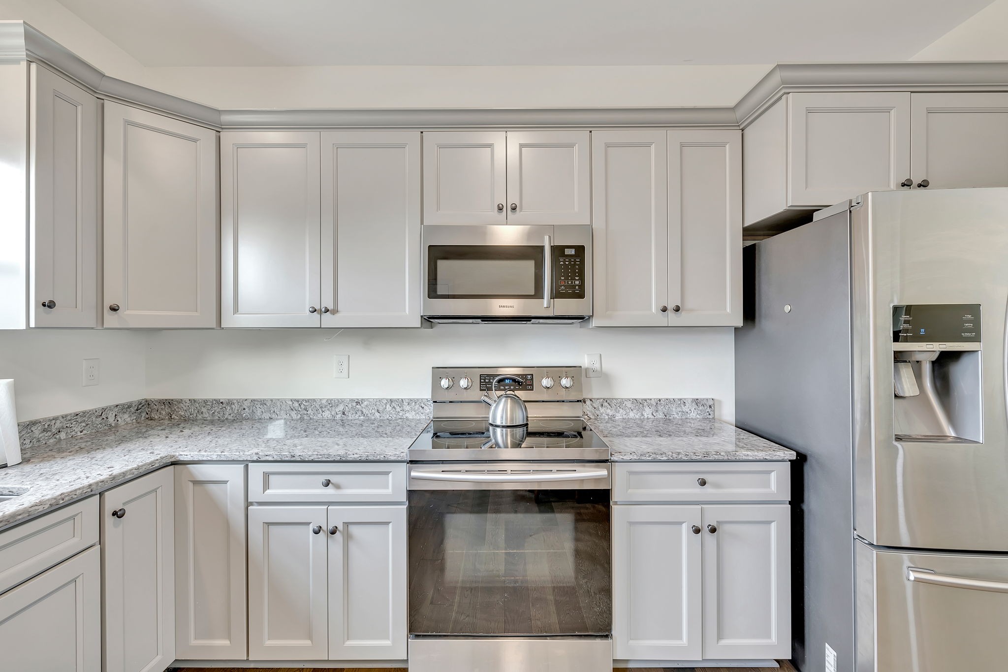 541 Murrell Road Dickson, TN 37055 - Photo 10 of 29 a kitchen with white cabinets and stainless steel appliances