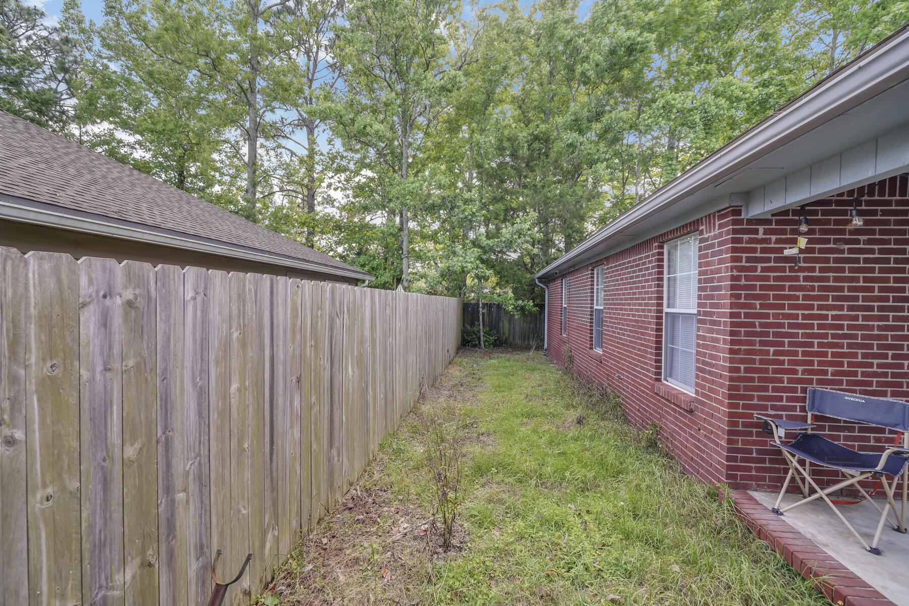 504 Easy Street Fort Walton Beach, FL 32547 - Photo 18 of 21 a view of a backyard with wooden fence