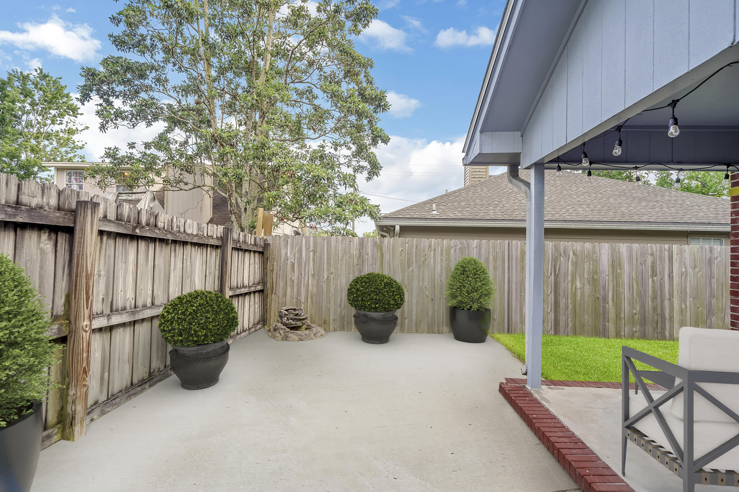 504 Easy Street Fort Walton Beach, FL 32547 - Photo 19 of 21 a view of a chairs and table in backyard of the house