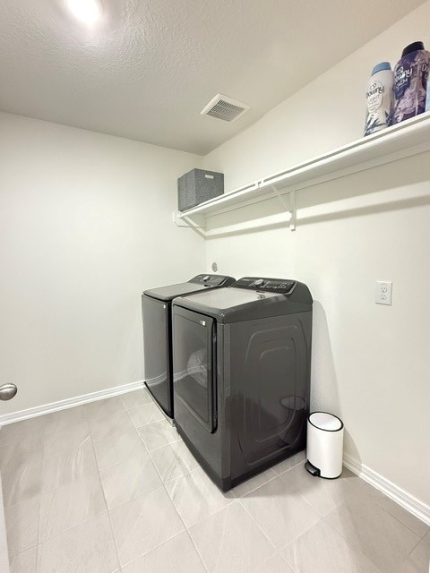 6415 Kentfield Drive Rosharon, TX 77583 - Photo 19 of 21 Dedicated laundry room with tile flooring, built-in shelving, and full-size washer and dryer.
