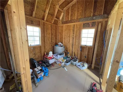 a view of a house with a yard and stairs