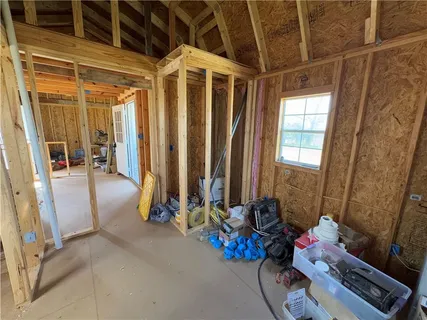 a view of an empty room with gym equipment
