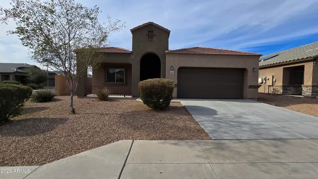 a view of a house with a yard and garage