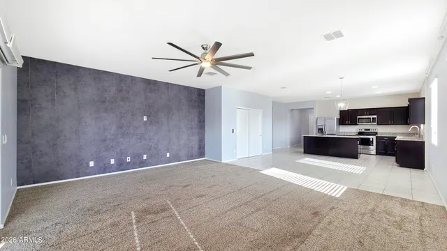 a view of a kitchen with a sink and cabinet