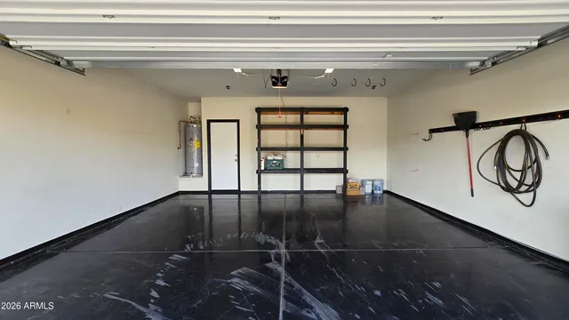 a view of a hallway with wooden floor and entryway