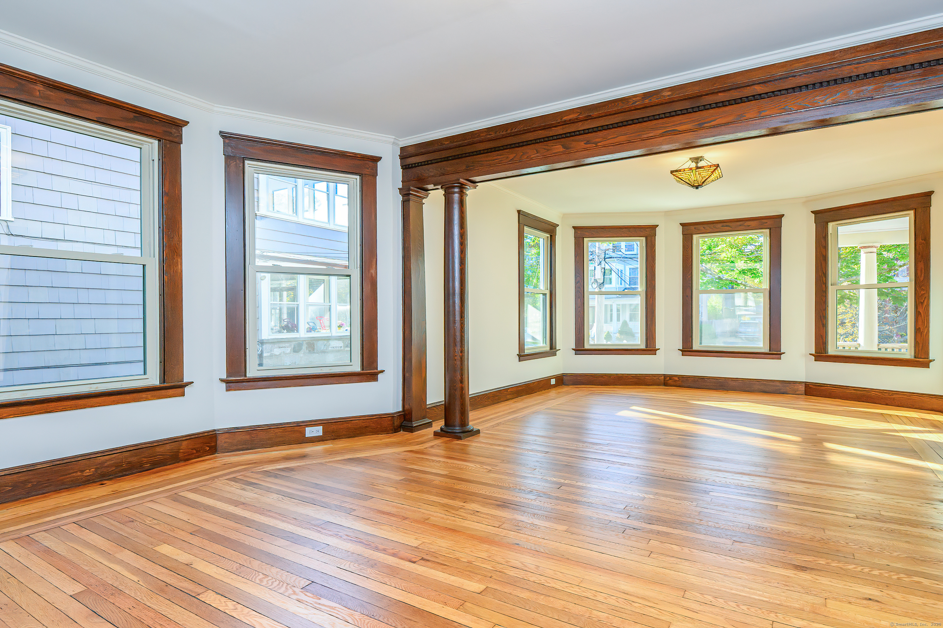 27 Hubinger Street, Unit 1 New Haven, CT 06511 - Photo 15 of 36 a view of an empty room with wooden floor and a window