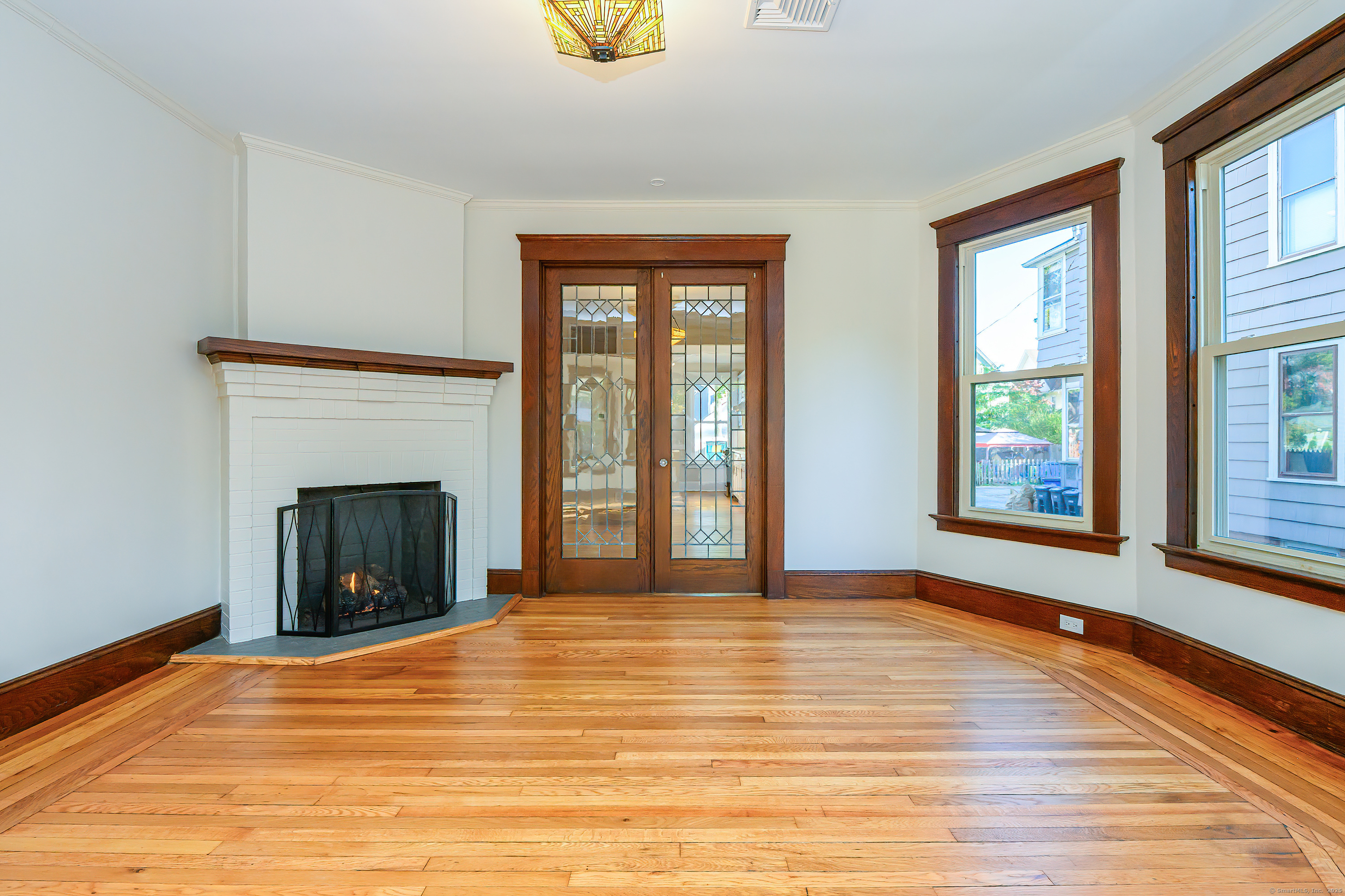 27 Hubinger Street, Unit 1 New Haven, CT 06511 - Photo 19 of 36 a view of an empty room with window and fire place