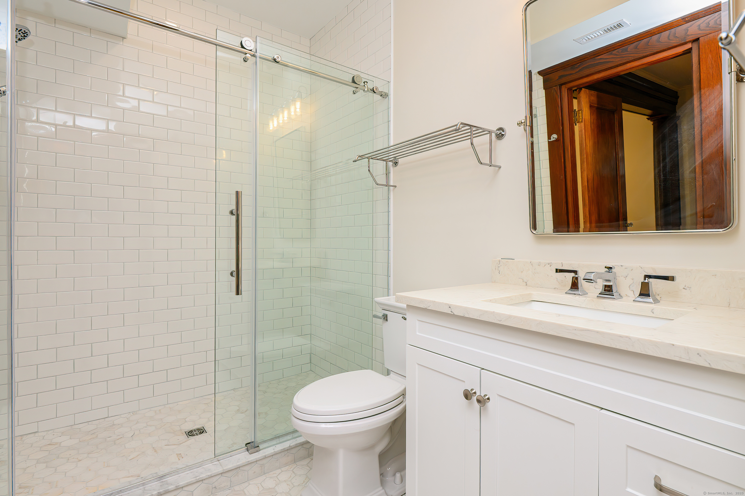 27 Hubinger Street, Unit 1 New Haven, CT 06511 - Photo 22 of 36 a bathroom with a sink a toilet and shower