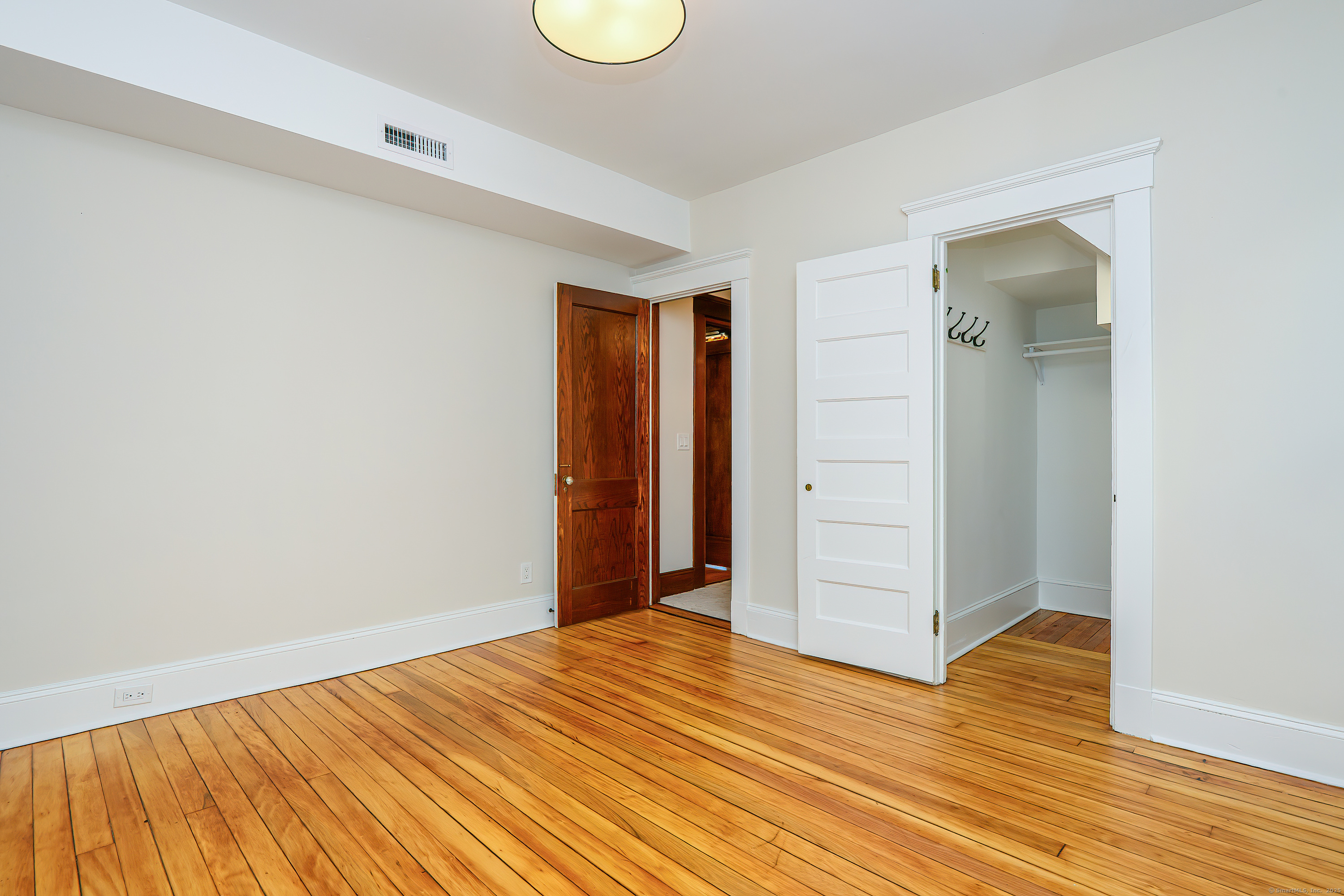 27 Hubinger Street, Unit 1 New Haven, CT 06511 - Photo 27 of 36 a view of a room with wooden floor