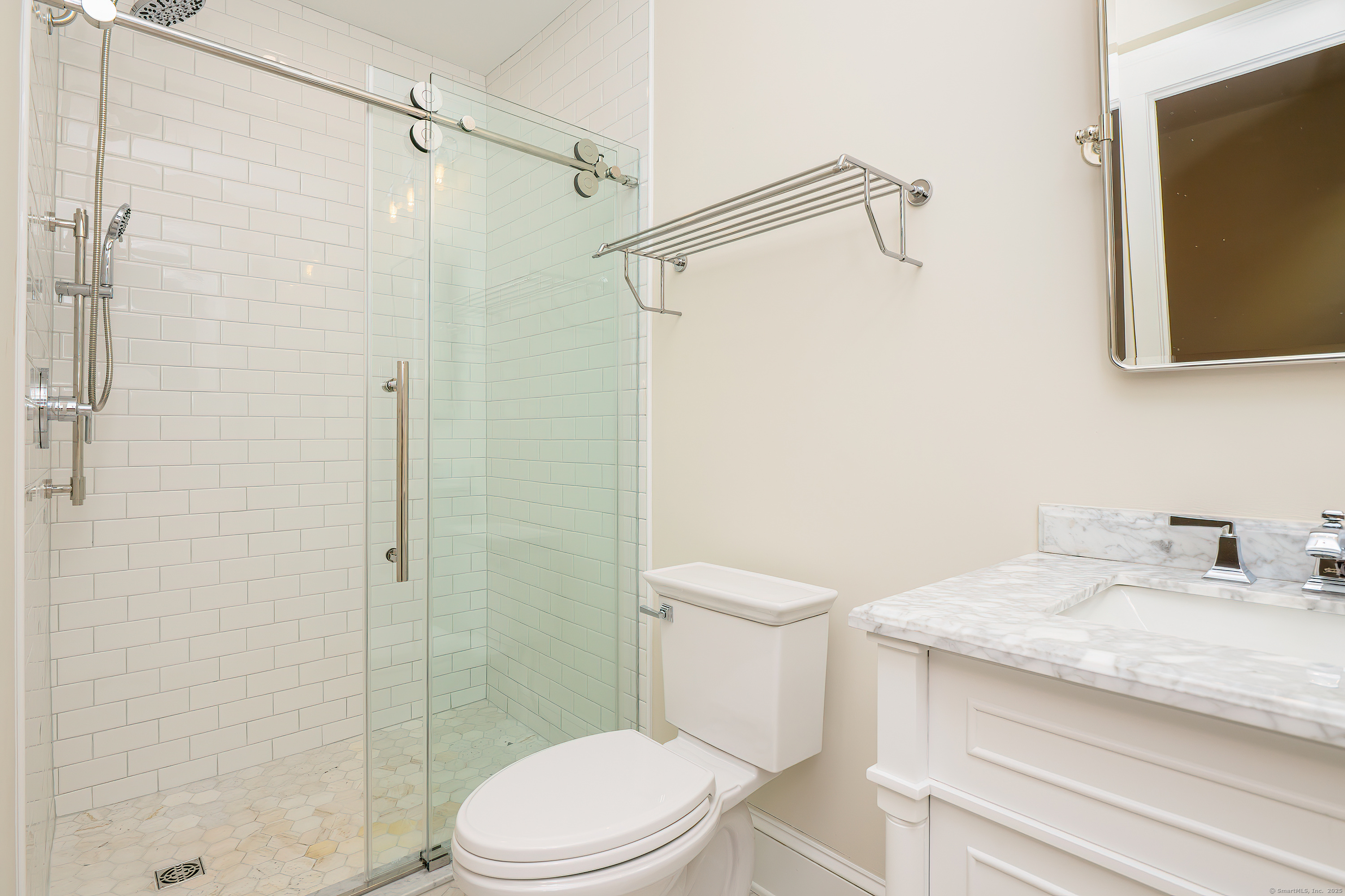 27 Hubinger Street, Unit 1 New Haven, CT 06511 - Photo 34 of 36 a bathroom with a granite countertop sink toilet and shower