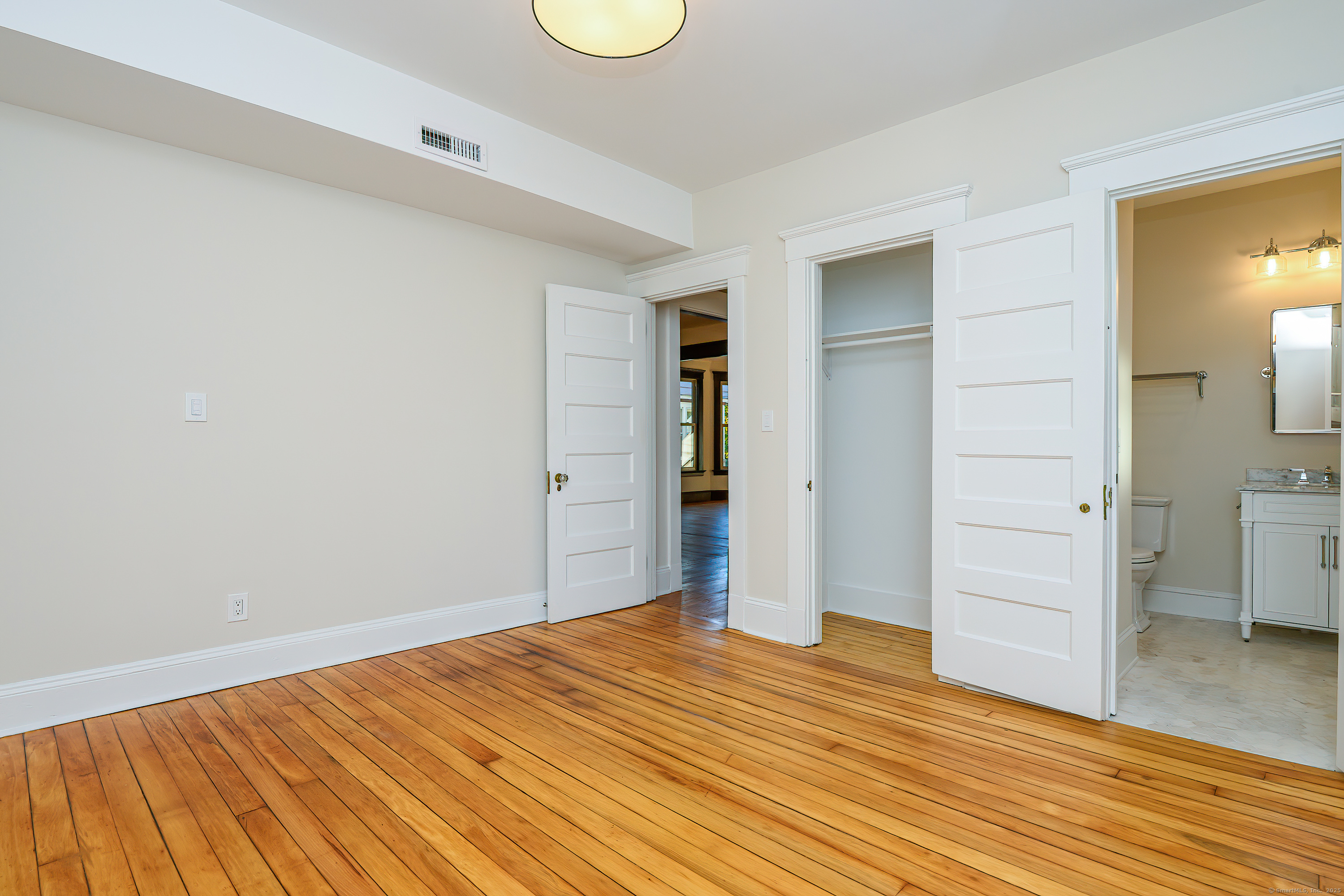 27 Hubinger Street, Unit 1 New Haven, CT 06511 - Photo 36 of 36 a view of empty room with wooden floor