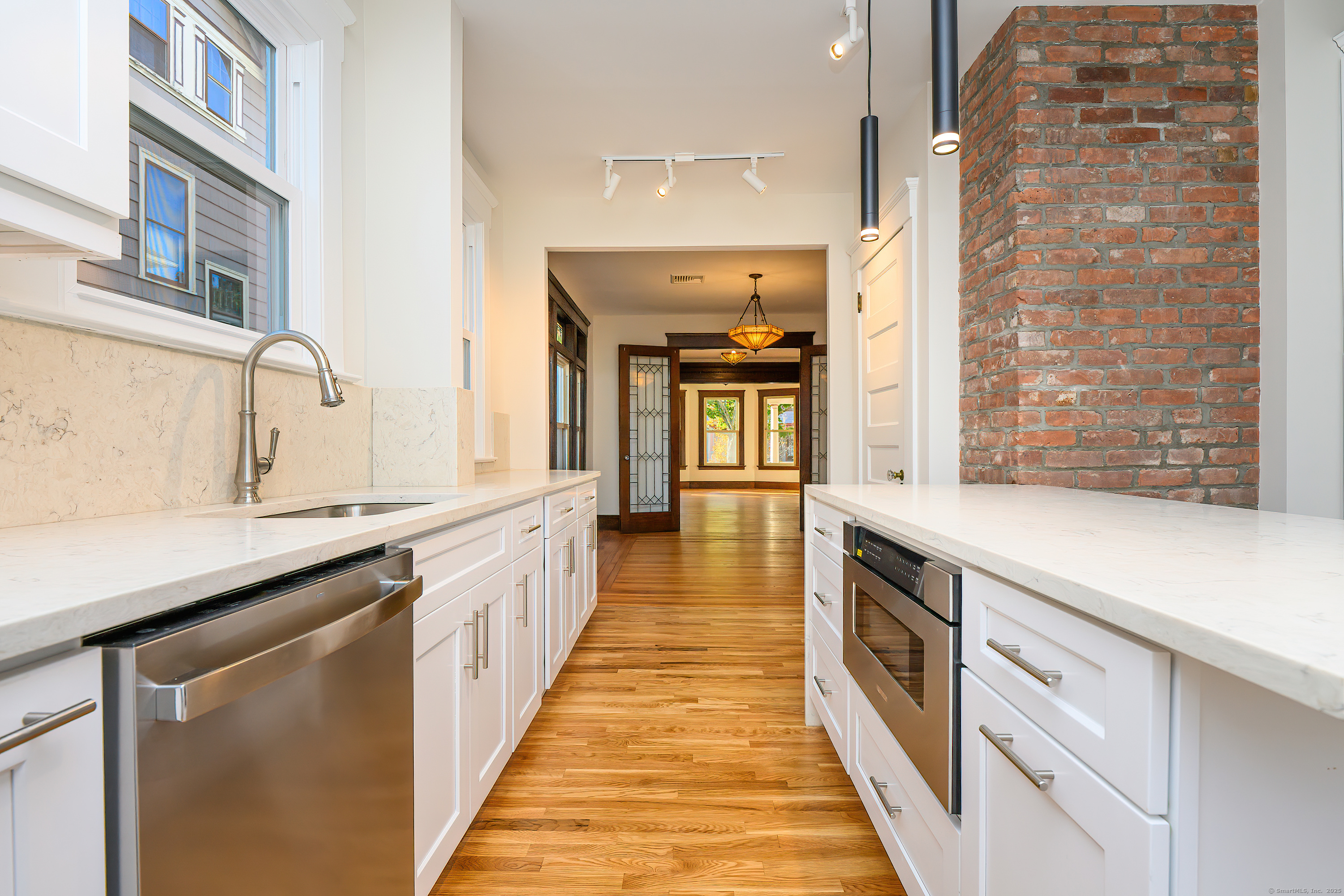 27 Hubinger Street, Unit 1 New Haven, CT 06511 - Photo 5 of 36 a kitchen with stainless steel appliances a sink and cabinets