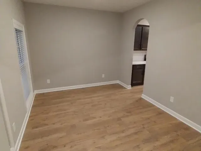 a view of empty room with stairs