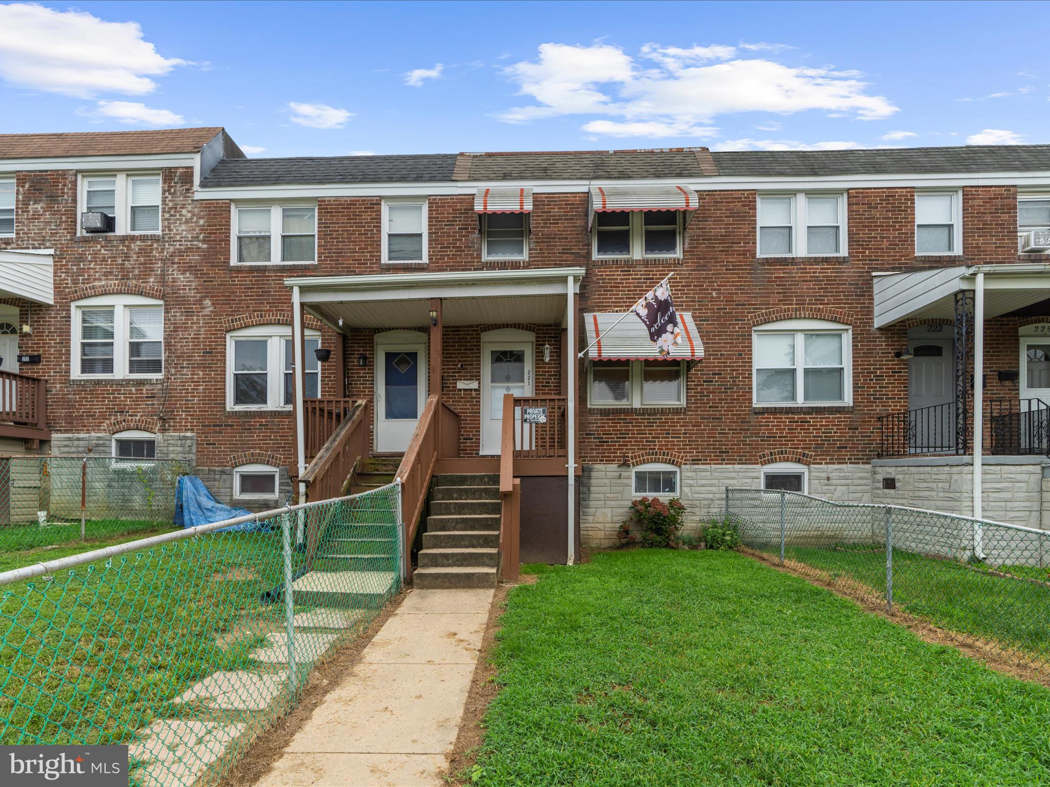 221 West Edgevale Road Baltimore, MD 21225 - Photo 3 of 37 front view of a house with a yard