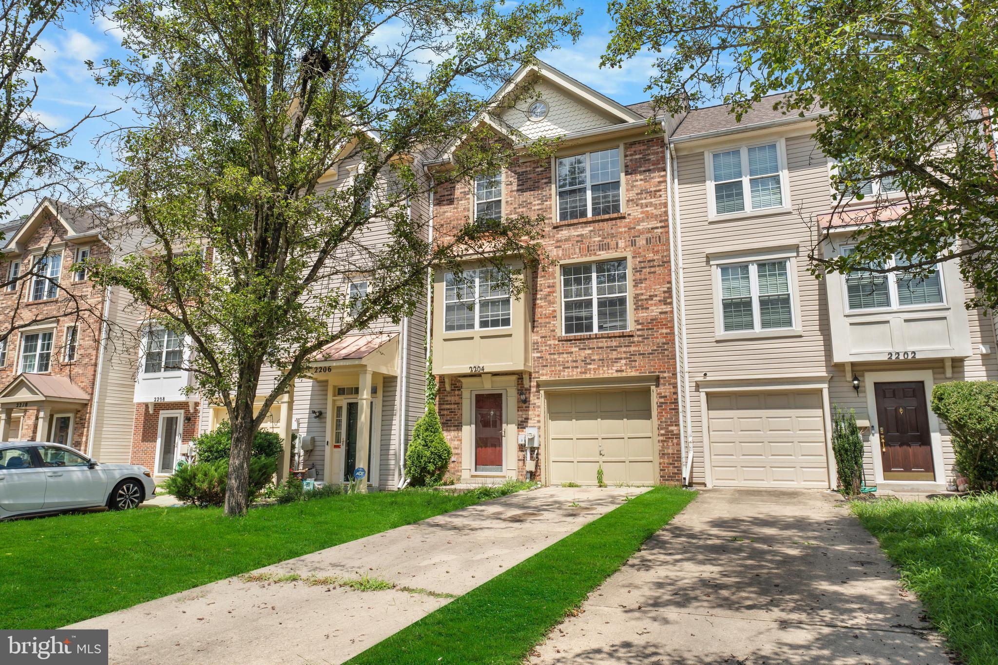 2204 Commissary Circle Odenton, MD 21113 - Photo 1 of 32 a front view of a house with a yard