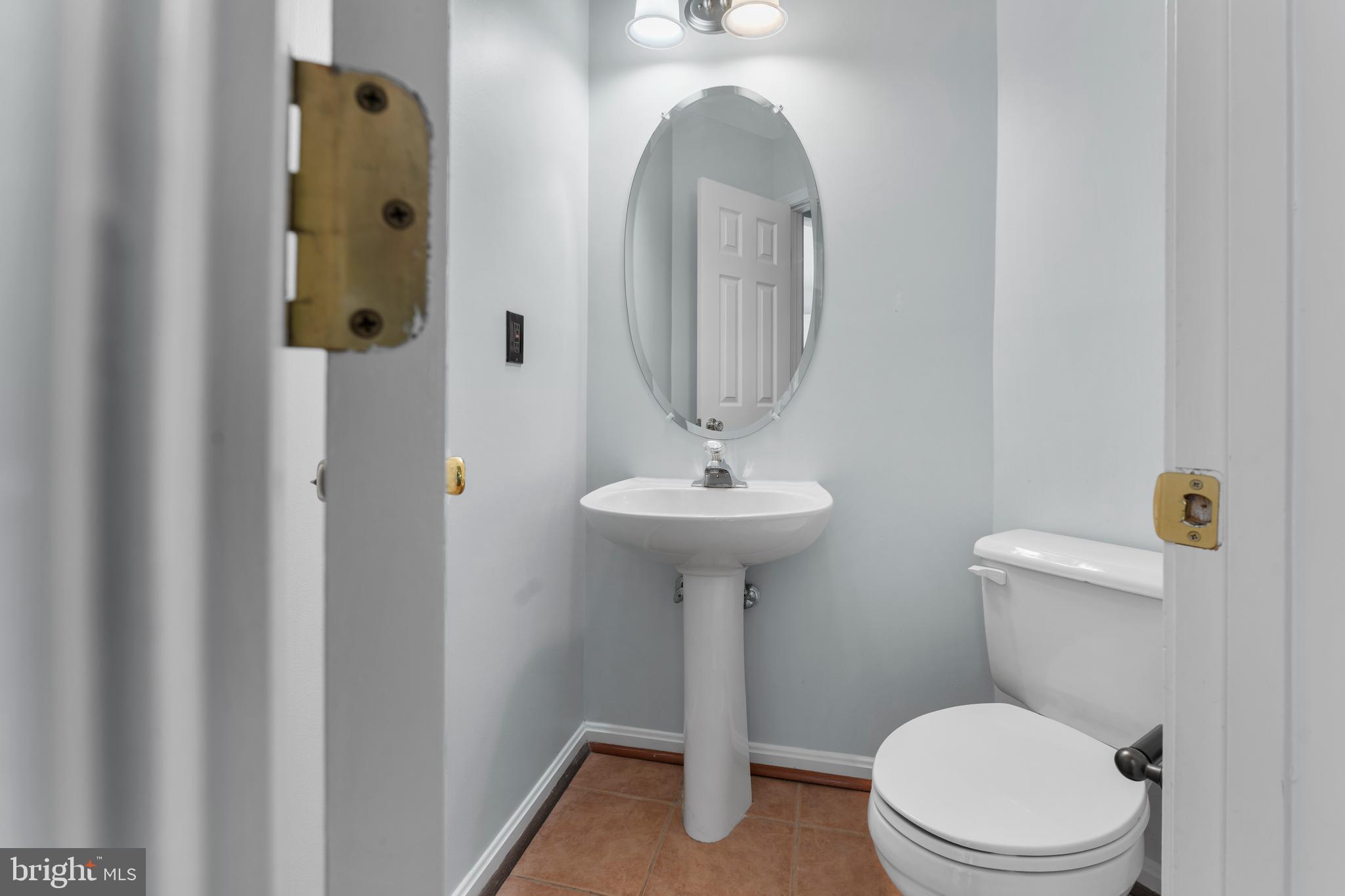 2204 Commissary Circle Odenton, MD 21113 - Photo 15 of 32 a bathroom with a toilet sink and shower