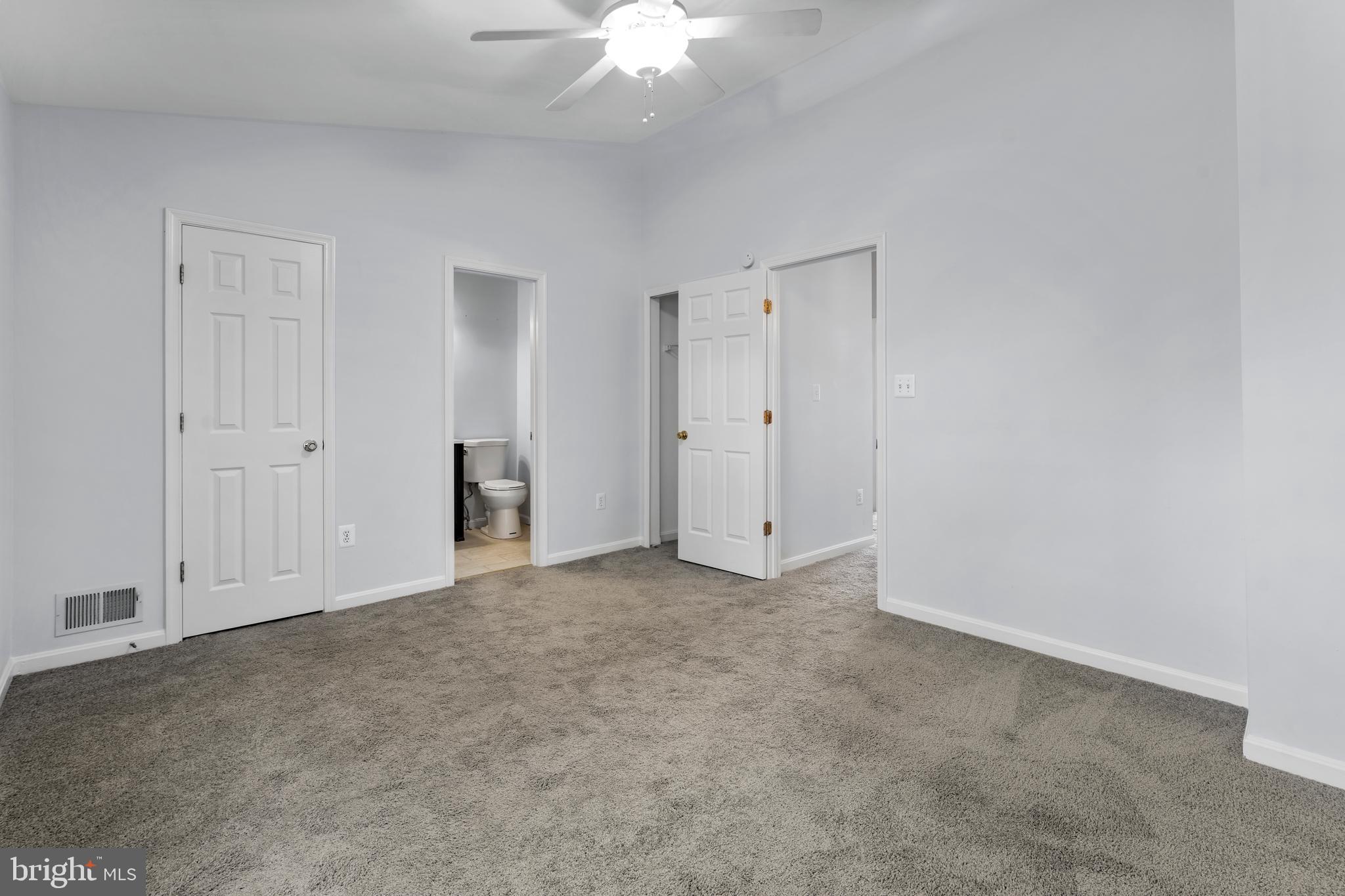 2204 Commissary Circle Odenton, MD 21113 - Photo 26 of 32 an empty room with a ceiling fan