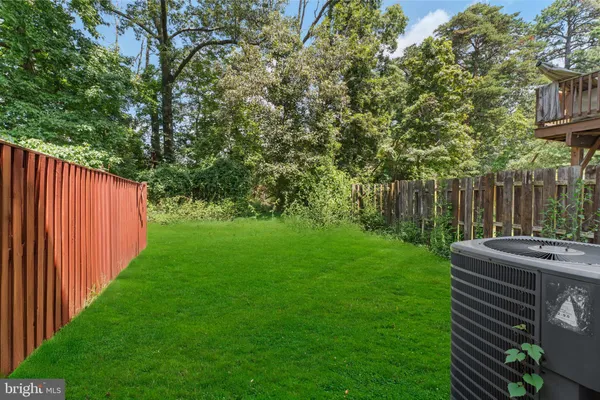 a view of backyard with seating and green space