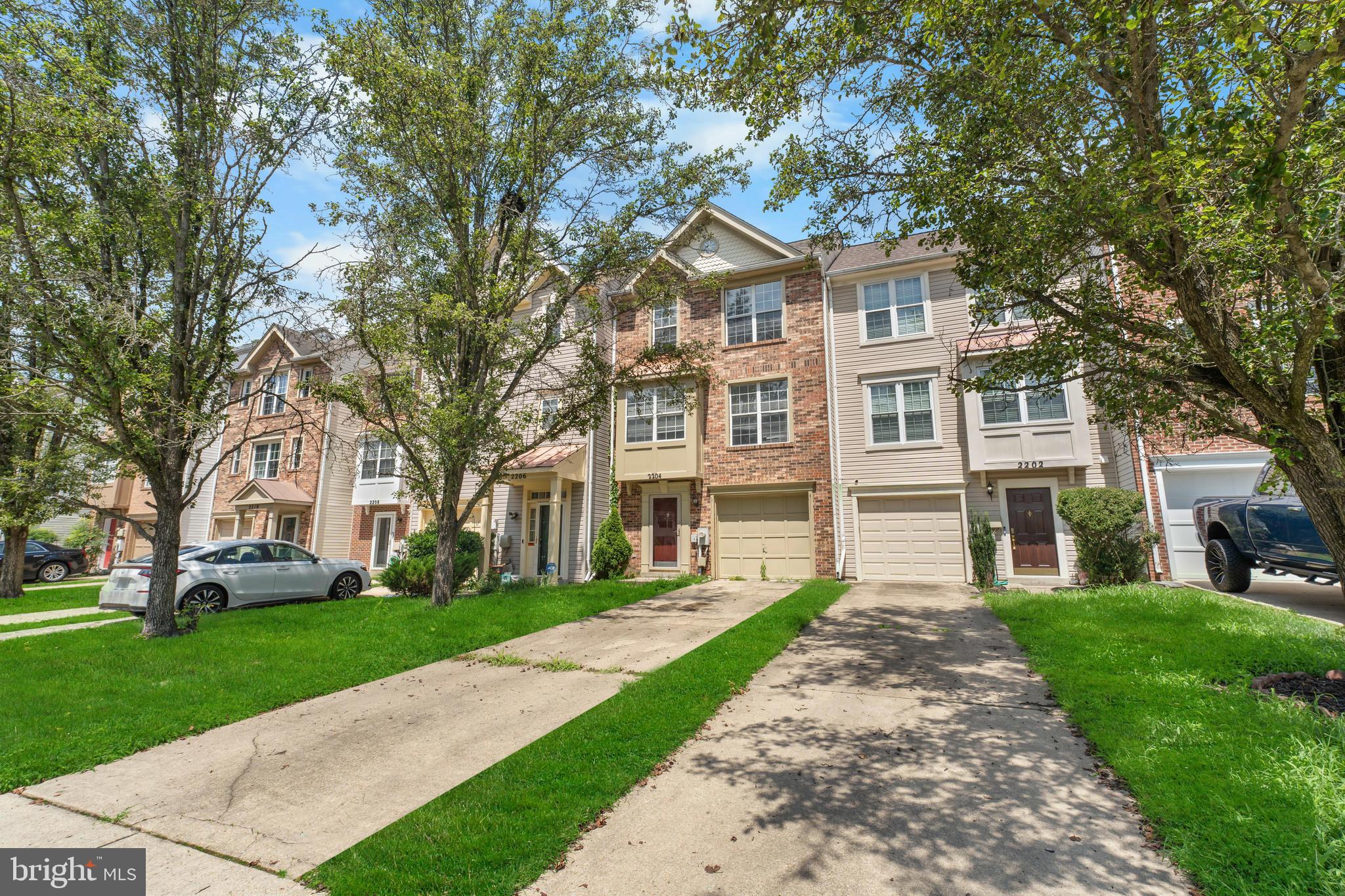 2204 Commissary Circle Odenton, MD 21113 - Photo 3 of 32 front view of a house with a yard