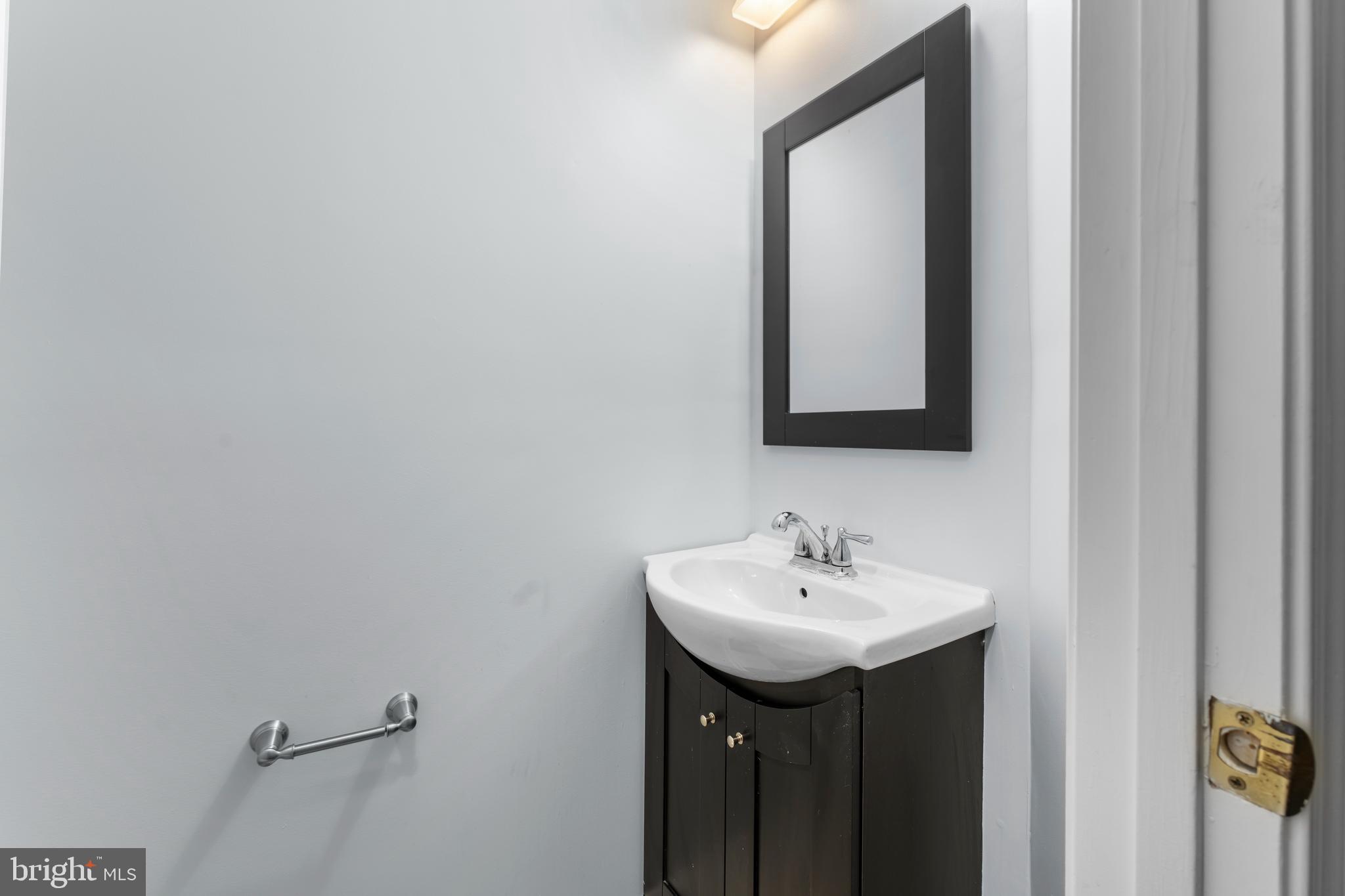 2204 Commissary Circle Odenton, MD 21113 - Photo 5 of 32 a bathroom with a sink and a mirror