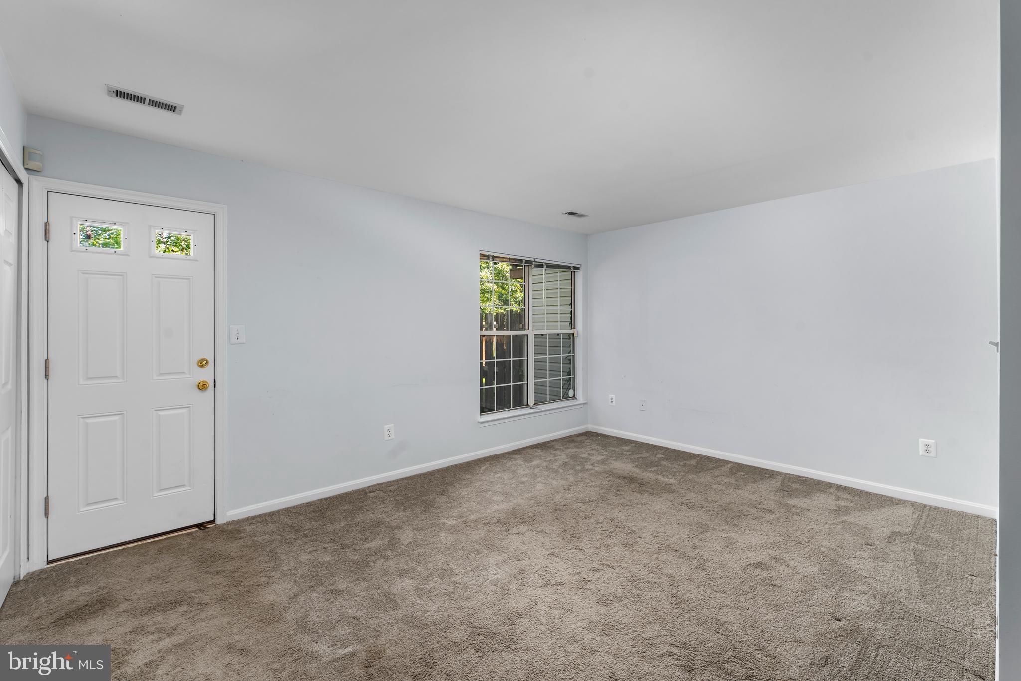 2204 Commissary Circle Odenton, MD 21113 - Photo 7 of 32 an empty room with windows