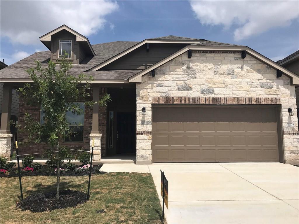 11208 Bruneau Trail Austin, TX 78754 - Photo 1 of 1 a front view of a house with garage