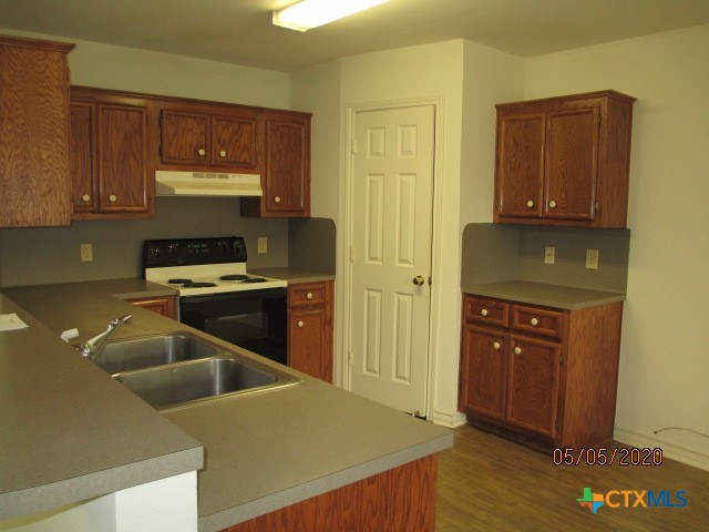 103 Evan Circle Victoria, TX 77901 - Photo 11 of 22 a kitchen with a cabinets and wooden floor