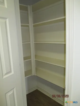 a empty closet with white paint