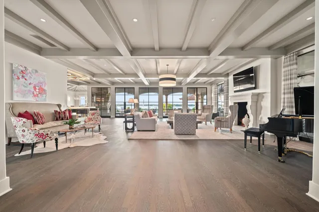 a living room with lots of furniture and a chandelier