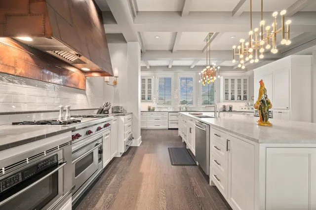 a dining room with furniture a fireplace and wooden floor