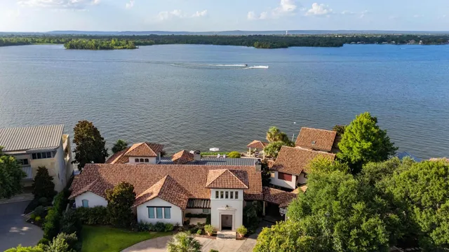 a front view of a house with a lake view