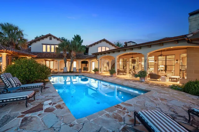 a front view of a house with swimming pool